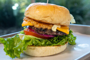 Cheeseburger with lettuce and tomato