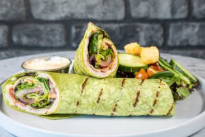 turkey lettuce and cheese wrap with side salad