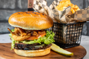 cheeseburger basket of fries and pickle
